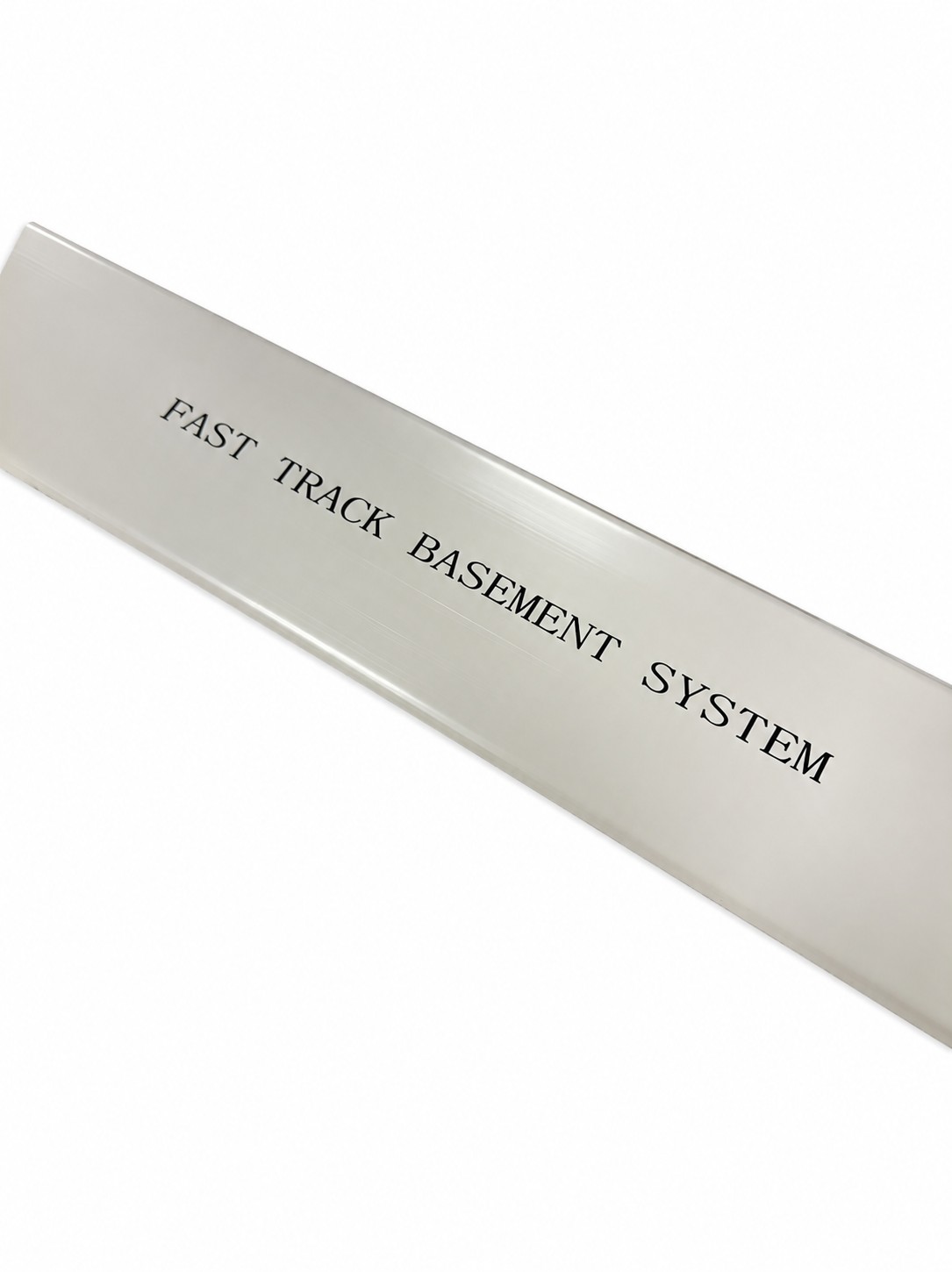Plastic strip labeled "FAST TRACK BASEMENT SYSTEM," showcasing BioPlastic Solutions' custom printing capabilities in plastic extrusion.
